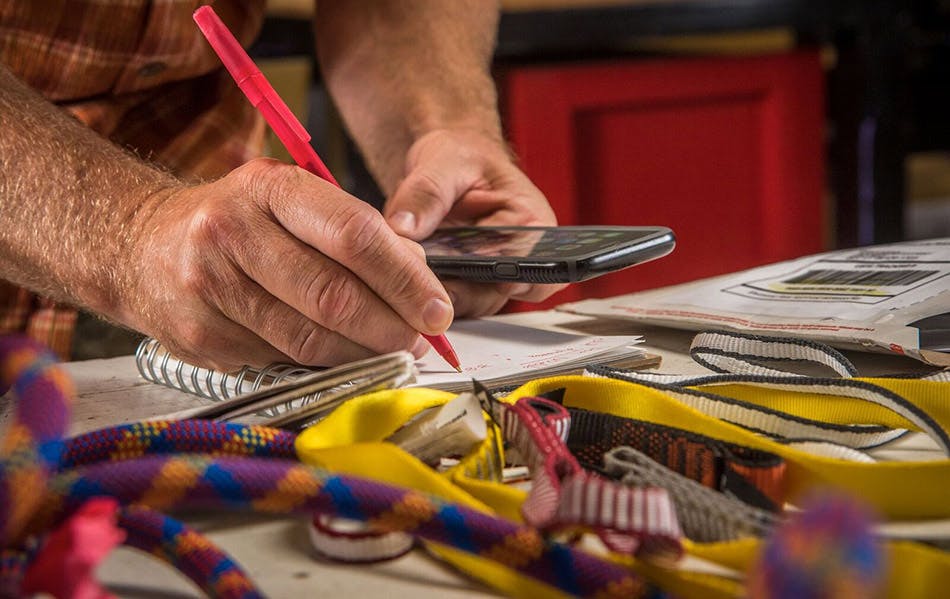 engineer taking notes for testing
