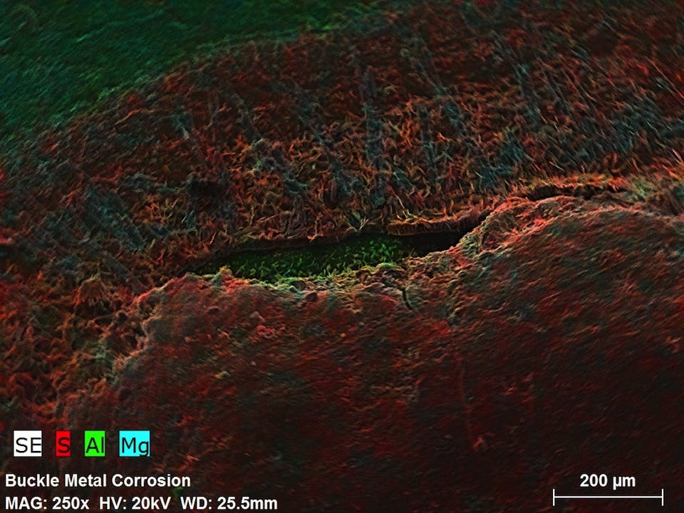 Microscopic examination of buckle chemical contamination.