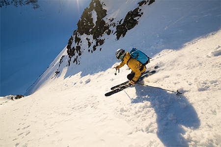 Photo of Antte Lauhamaa skiing in the mountains.