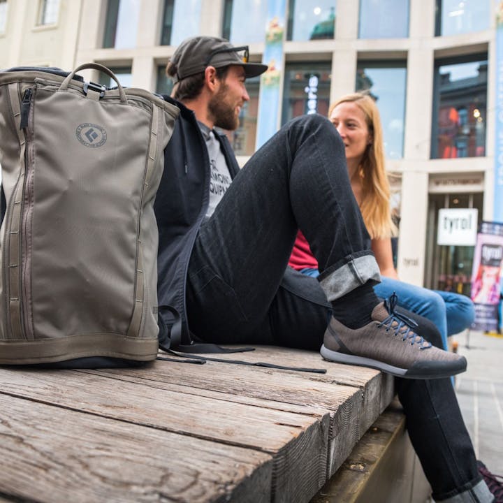 Photograph by Andy Earl of two people sitting outside in a city center