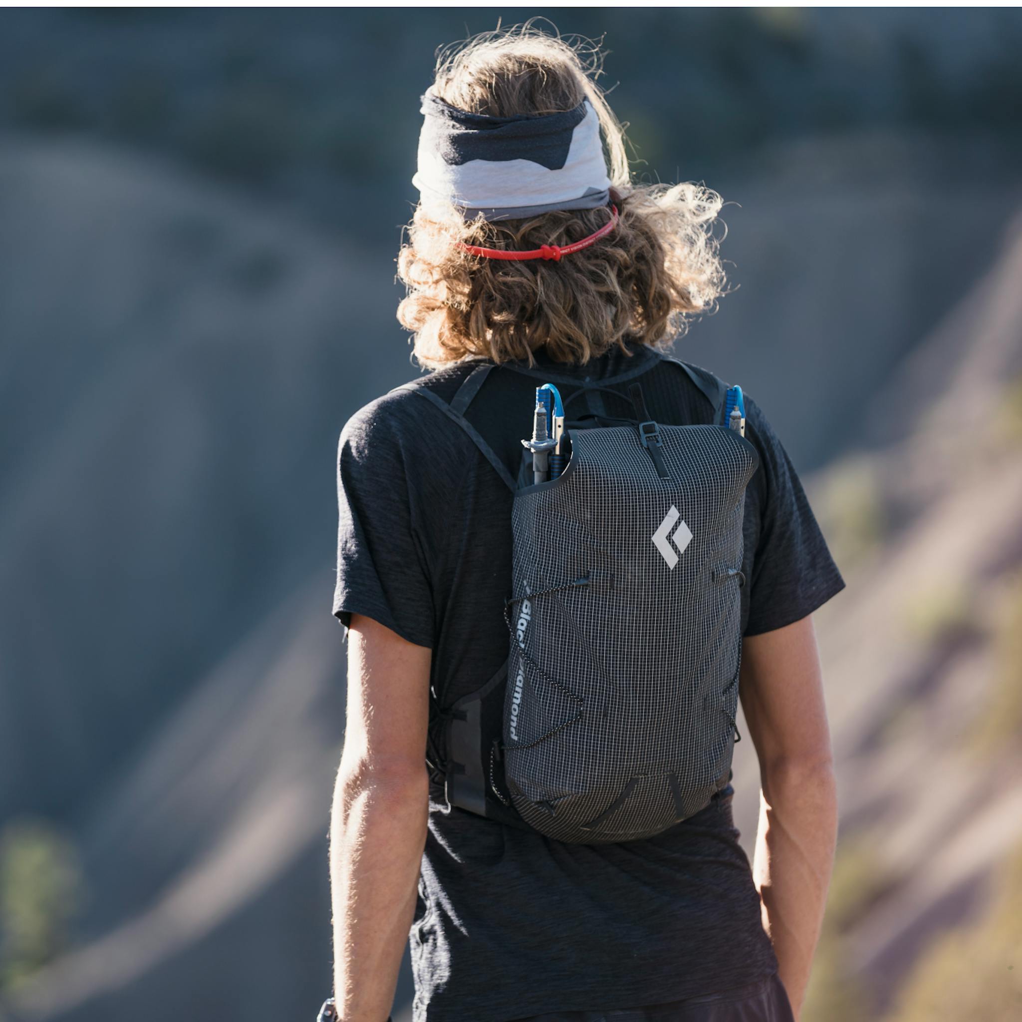 Runner with Trekking poles in Backpack
