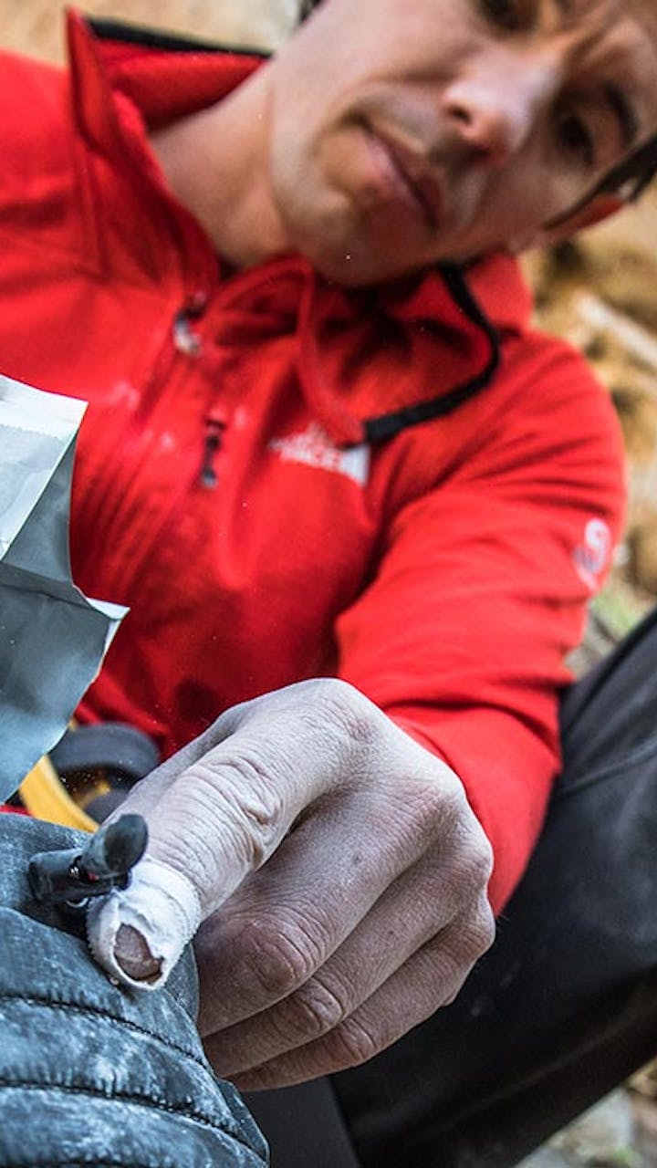 Alex pouring chalk into his heated chalk bag