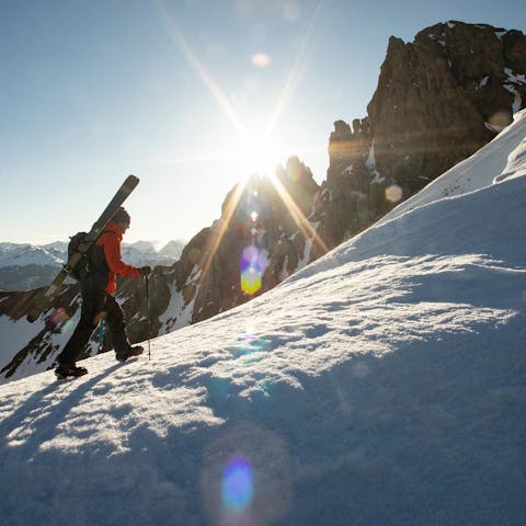 Skier bootpacking up a ridgeline. 