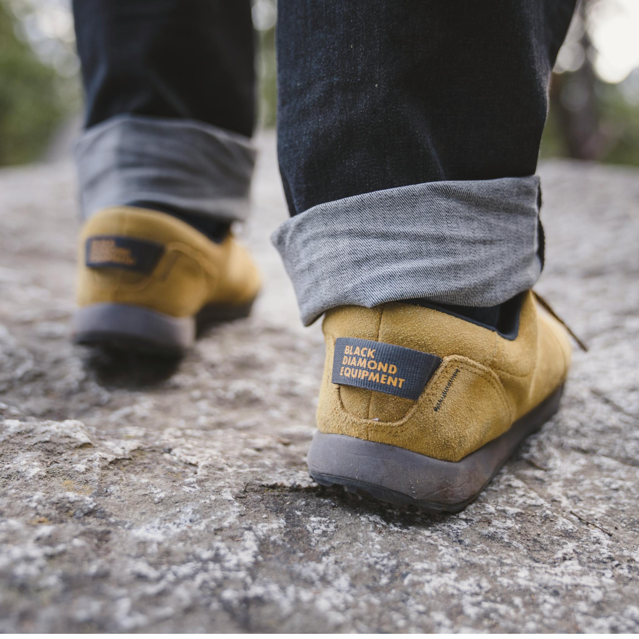 Heel detail shot of Men's Prime Shoes in colorway Amber/Carbon on a boulder