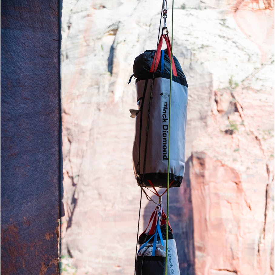 Two haul bags being pulled up the wall.