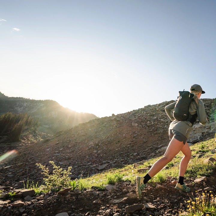 Photograph by Christian Adam of Mary McIntyre and a man trail running | running backpack | running pack