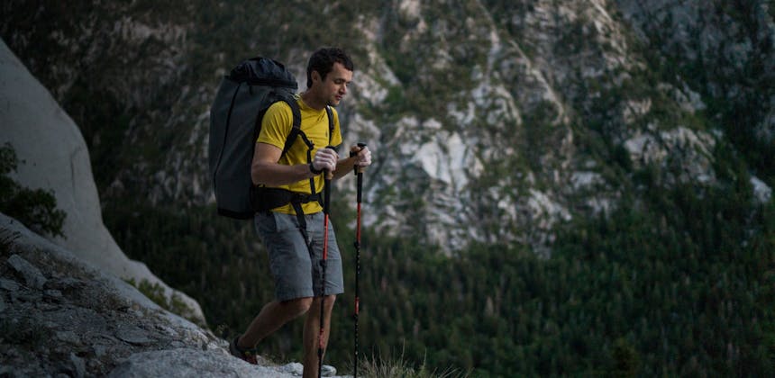 Black Diamond employee approaching the crag with the Alpine Carbon Cork Trekking poles.