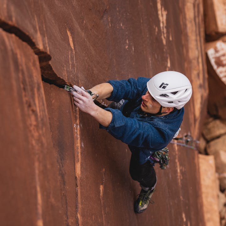 BD athlete Connor Herson places a C4 cam in an Indian Creek splitter crack. 