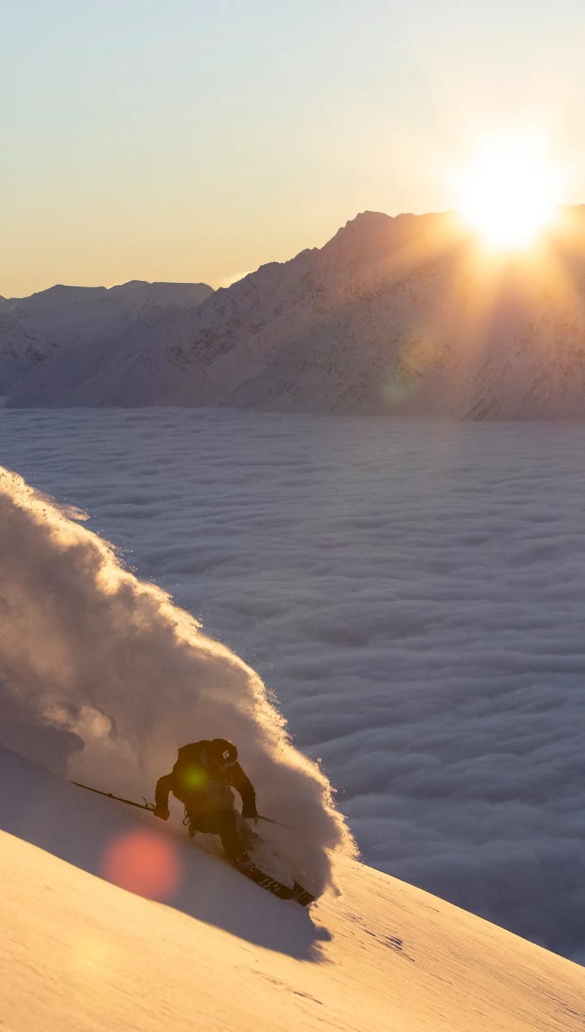 Skier in front of a sunset