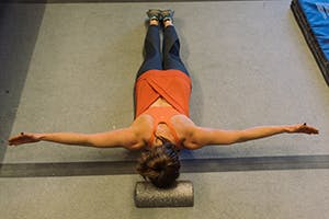 arms outstretched, T position