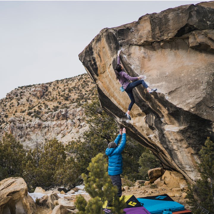 Two climbers bouldering on a route | Bouldering equipment