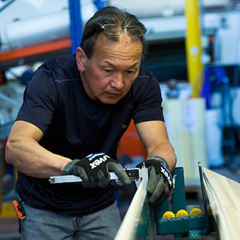 man measuring skis