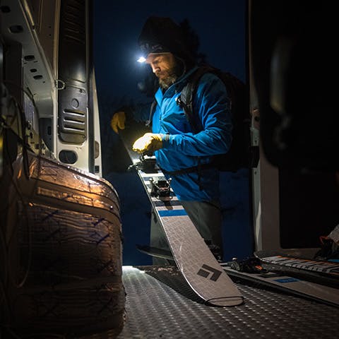 man getting his skis ready for a dawn patrol