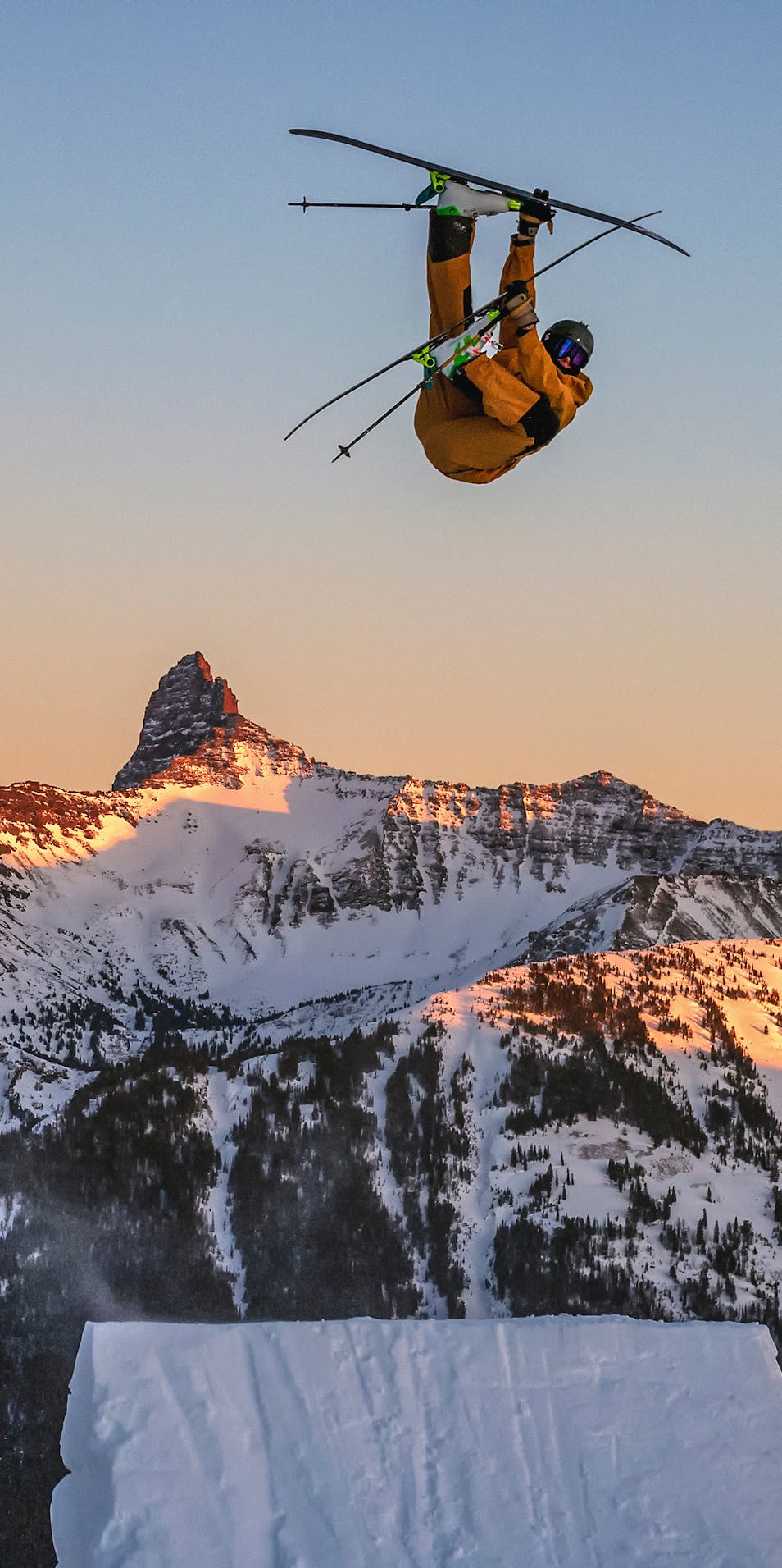 Black Diamond Athlete Parkin Costain hitting a ski jump in the backcountry