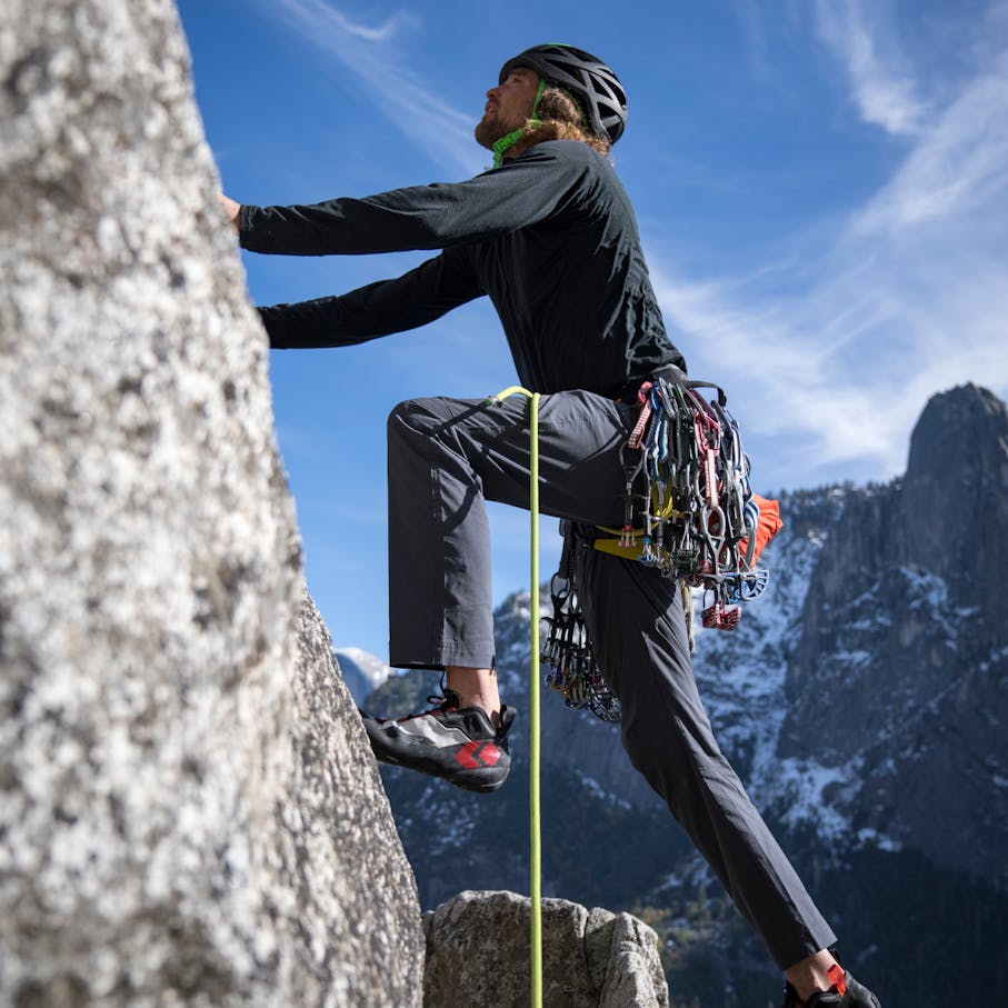 A climber wearing the Technician Alpine Pants