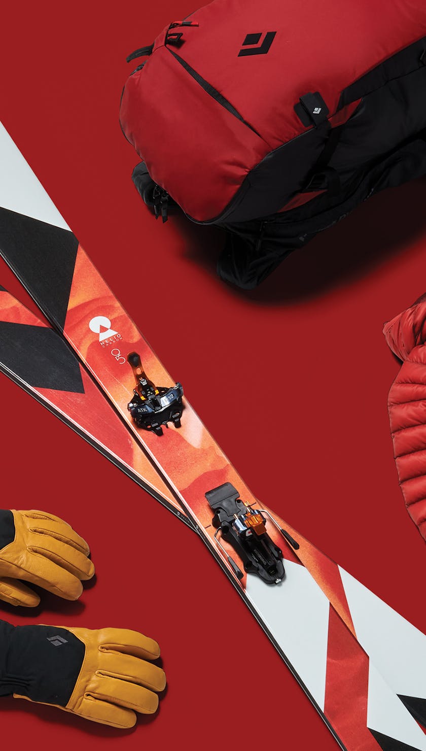 A lay down image of a Black Diamond ski kit with a red holiday theme.  