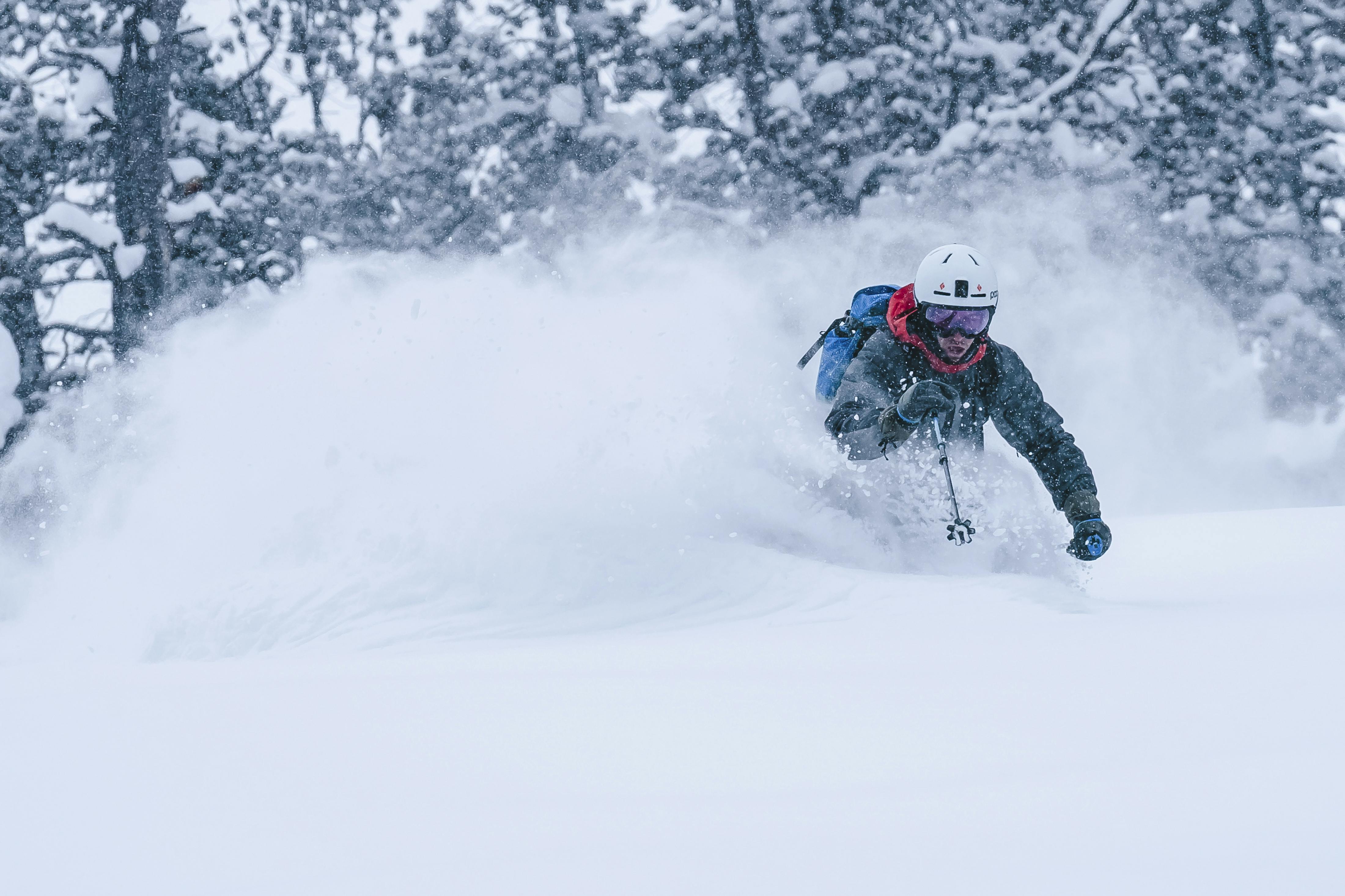 Black Diamond athlete Isaac Freeland laying powder trenches in the backcountry.