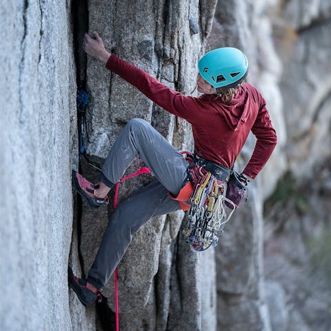 A climber wears the Black Diamond Coefficient hoody while climbing in Little Cottonwood canyon, UT.