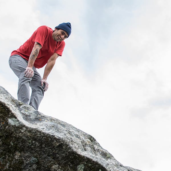 Sam looking over the top of a boulder