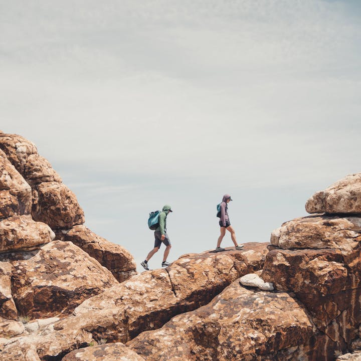 Two Climbers walking in the desert in Black Diamond apparel.  