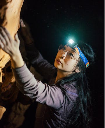 Black Diamond ambassador bouldering with the Cosmo 350 Pride edition headlamp.