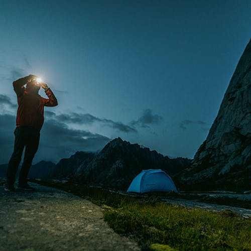 Person wearing an Icon 700 Headlamp while camping