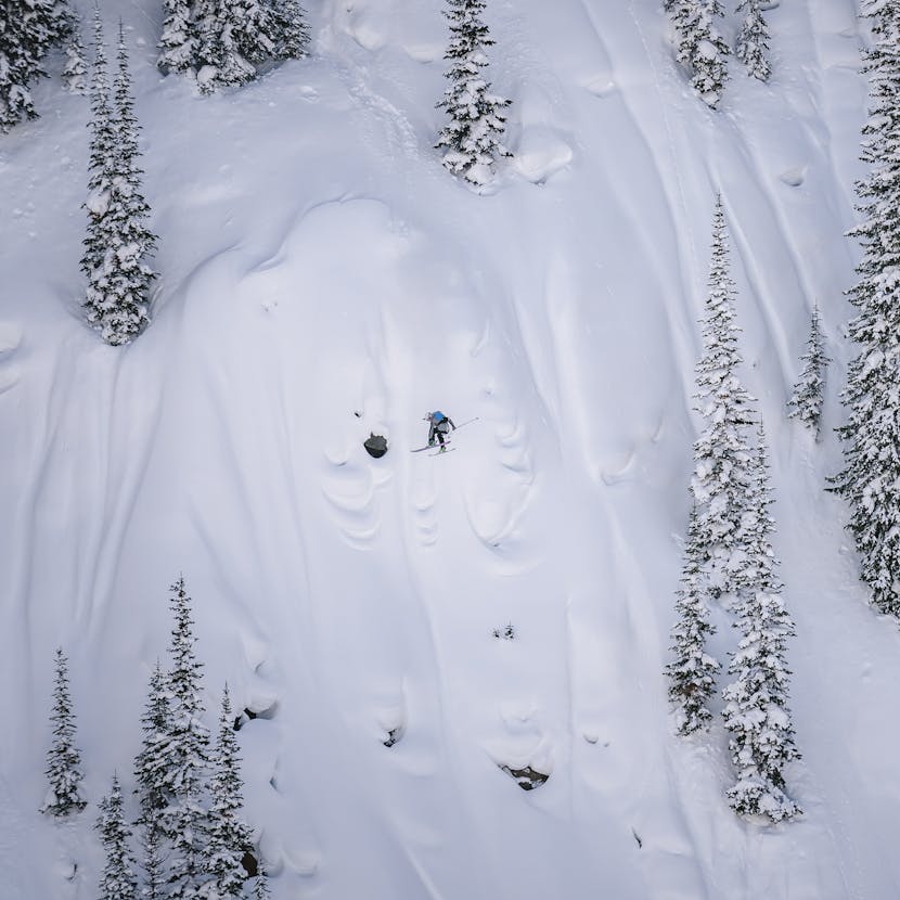 Black Diamond athlete Isaac Freeland sending a cliff drop in the backcountry.