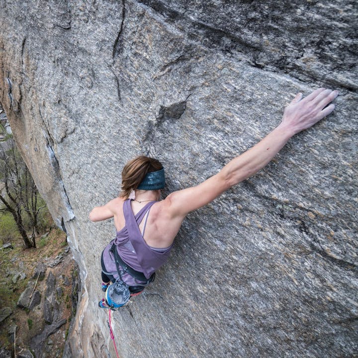 Photograph by Andy Earl of Babsi Zangerl rock climbing
