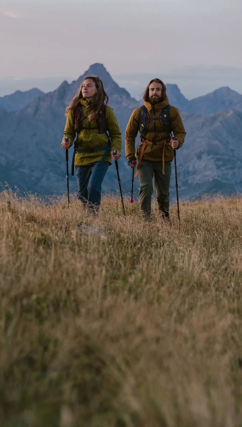 Two hikers using Black Diamond Pursuit series trekking poles. 
