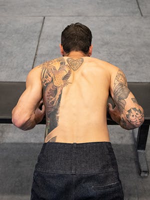 Photo of Sam Elias in mid pushup form.