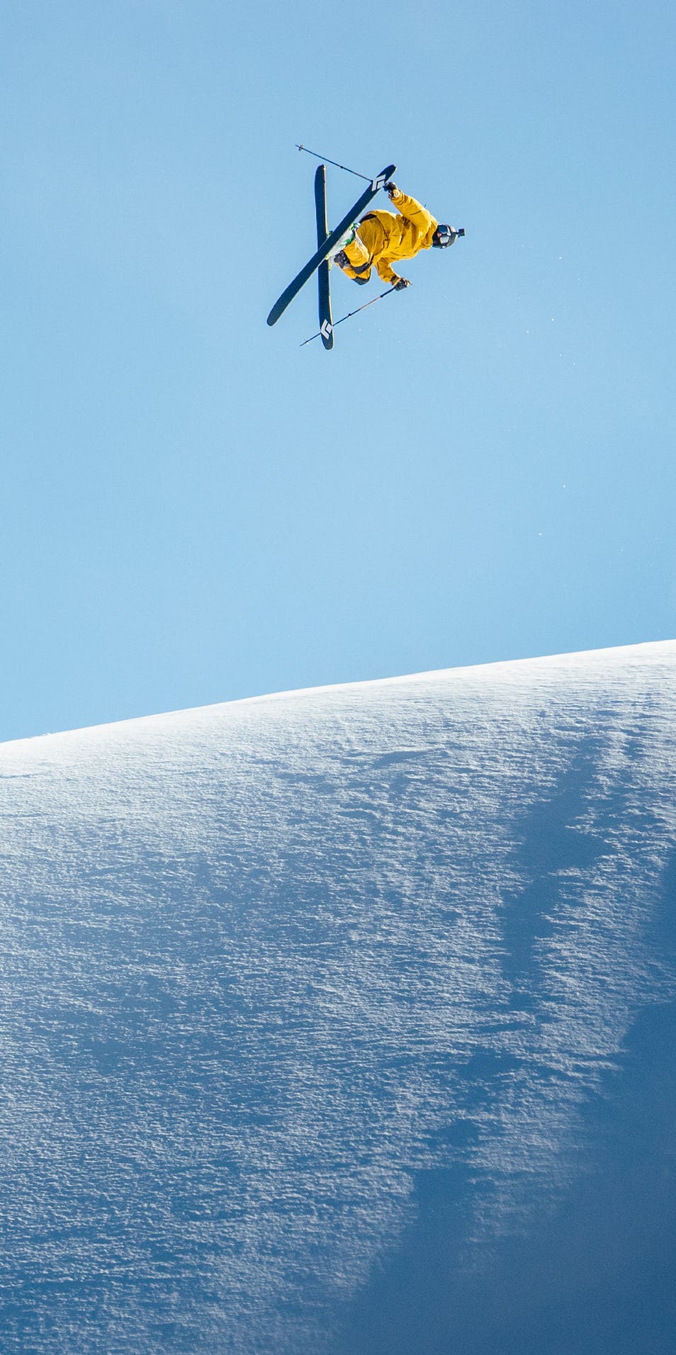 Black Diamond Athlete Parkin Costain hitting a jump in Cooke City, Montana.