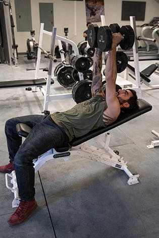 Sam Elias performing dumbbell fly