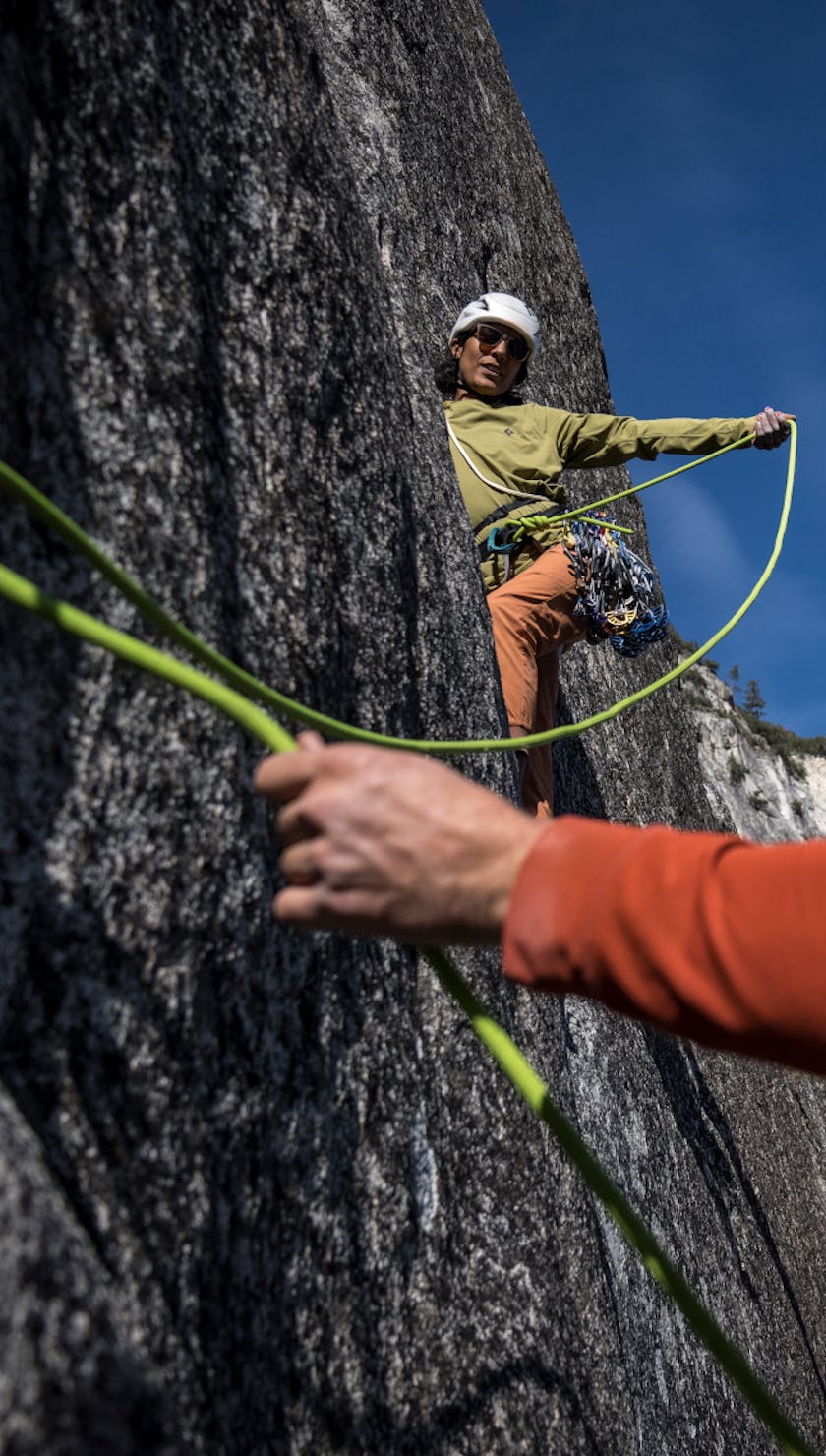 Two climbers wearing the Black Diamond Alpenglow Hoody.