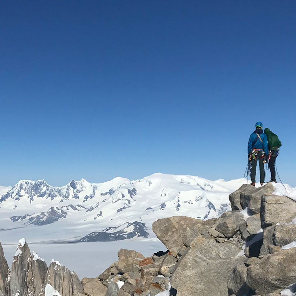 Climbers atop mountains