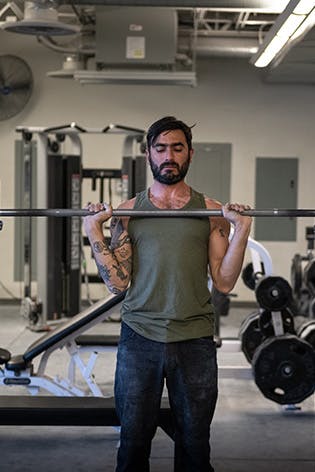 Sam Elias performing an overhead press
