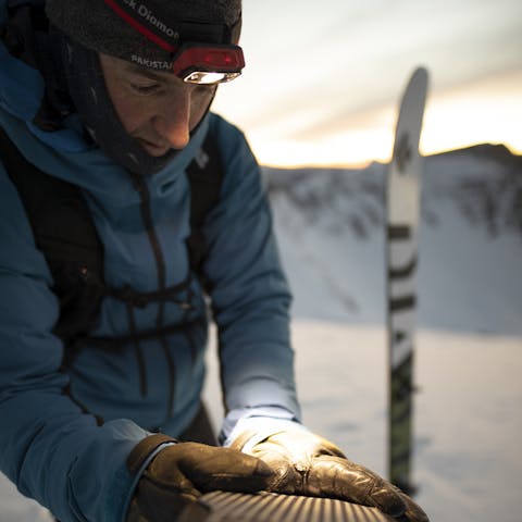Black Diamond Athlete Mike Barney attaching his skin to his skis.