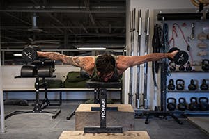 Sam Elias performing reverse dumbbell fly