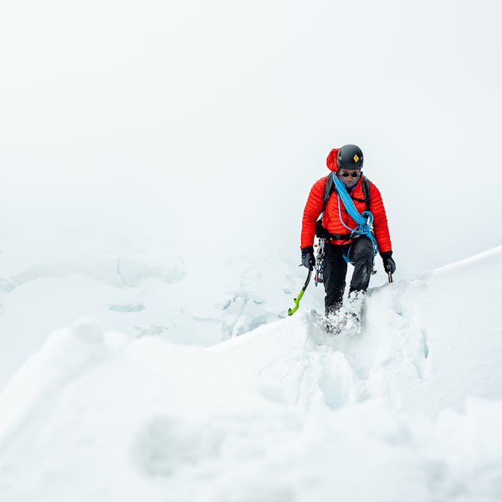 BD Ambassador Andrew King walking over a wind swept snow drift in the Alps. 