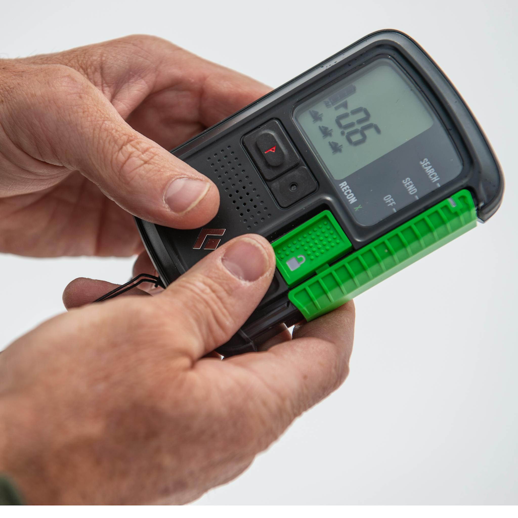 Man holding the Recon X beacon