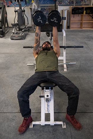 Sam Elias performing dumbbell fly