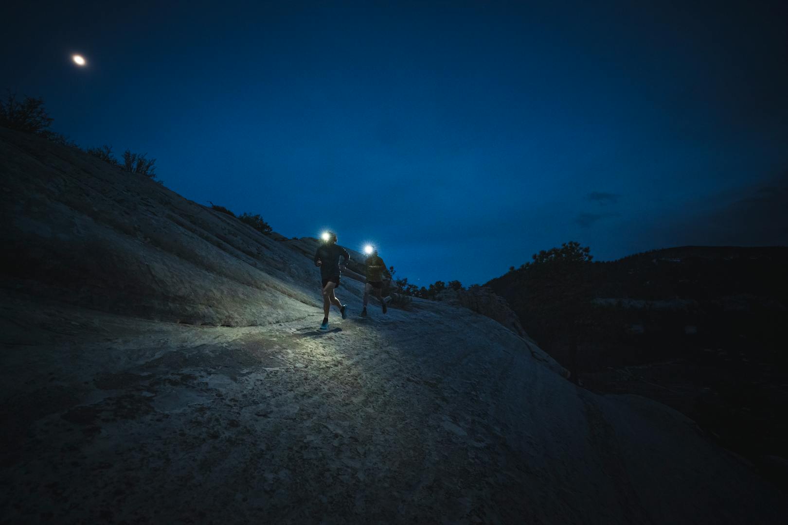 BD athletes Kyle Richardson and Joe Grant running at night