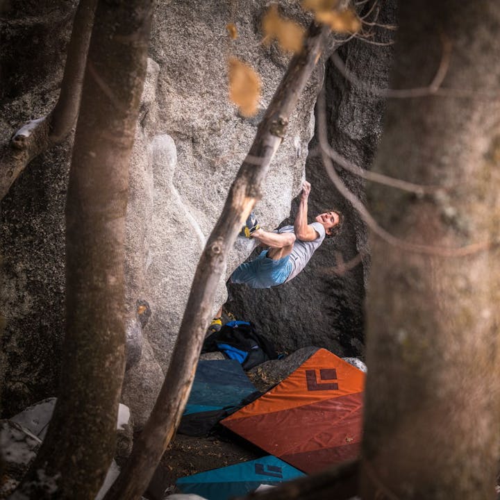Photograph by Andy Earl of Adam Ondra bouldering