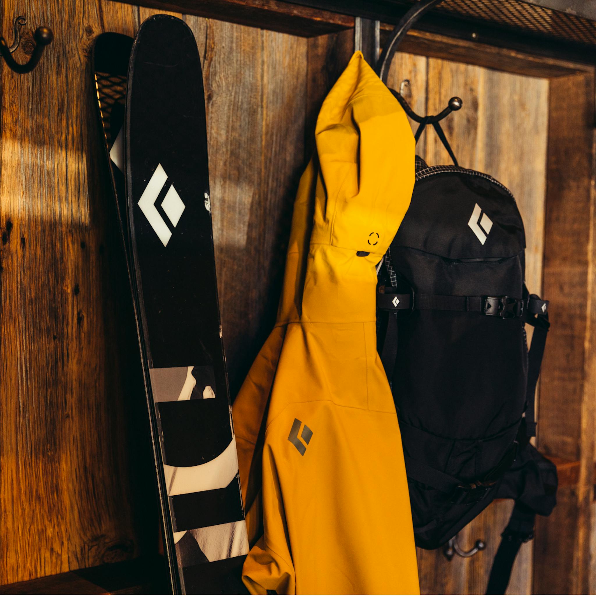 A Black Diamond outerwear kit hanging in a house.