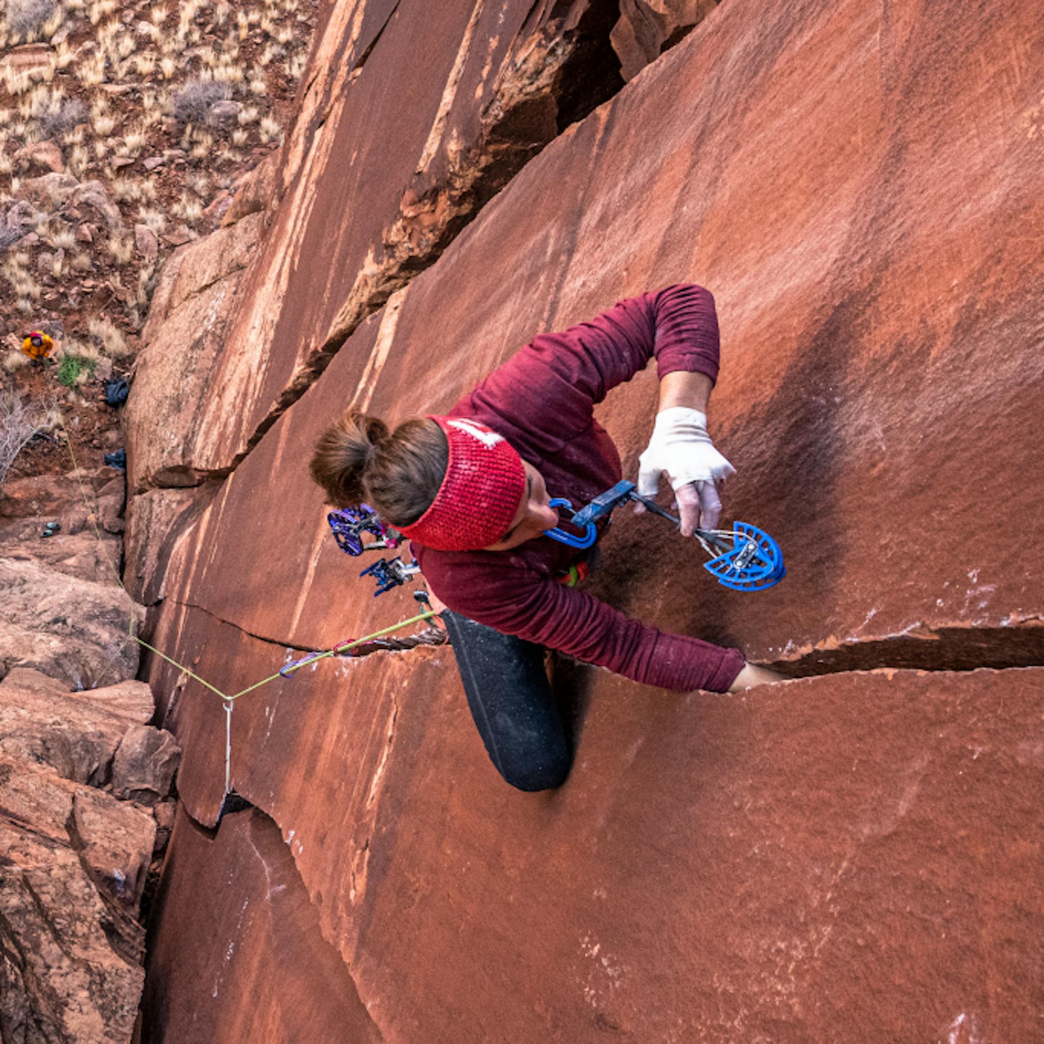 BD athlete Babsi Zangerl working her way up a wide desert crack.
