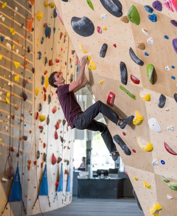 Black Diamond employee squeezes in a bouldering session on his lunch break wearing the Forged Denim Pants. 
