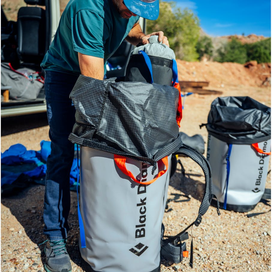 A climber loads up a Wall Hauler 140 haul bag.