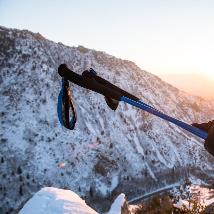 Photograph by Andy Earl of a person holding ski poles in the mountains