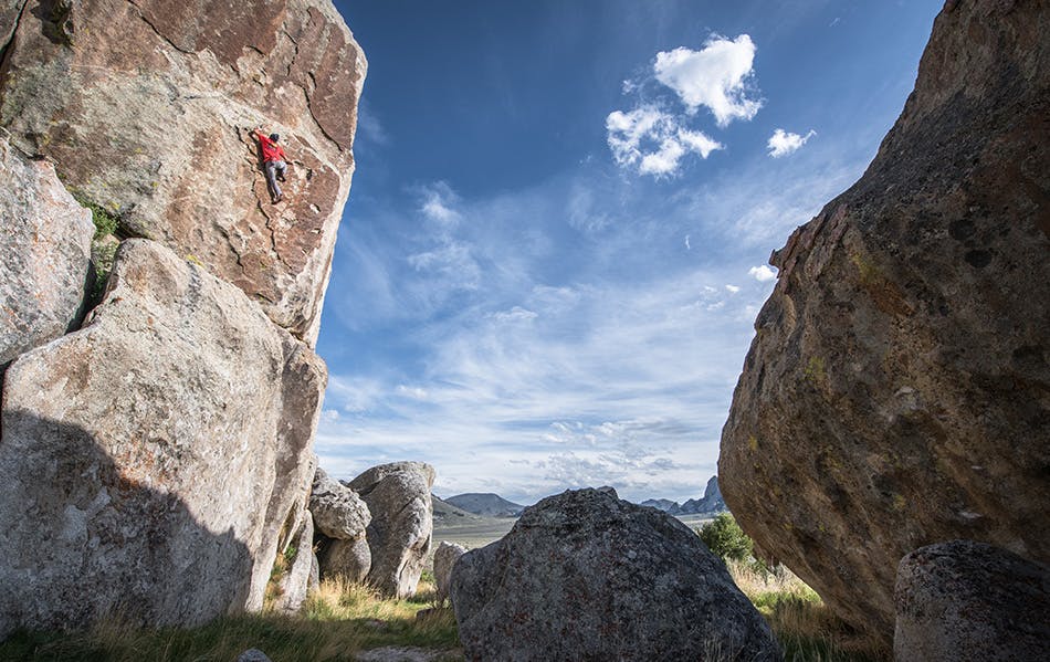 athlete climbing up a route