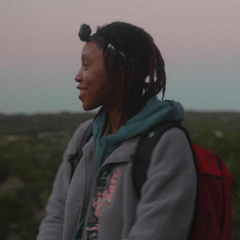 A member of The Black Outside wearing a headlamp.
