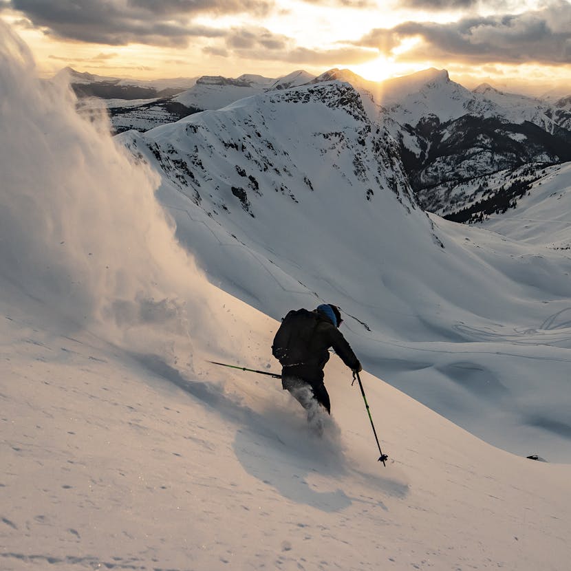 Black Diamond Athlete Mike Barney skiing at dusk.